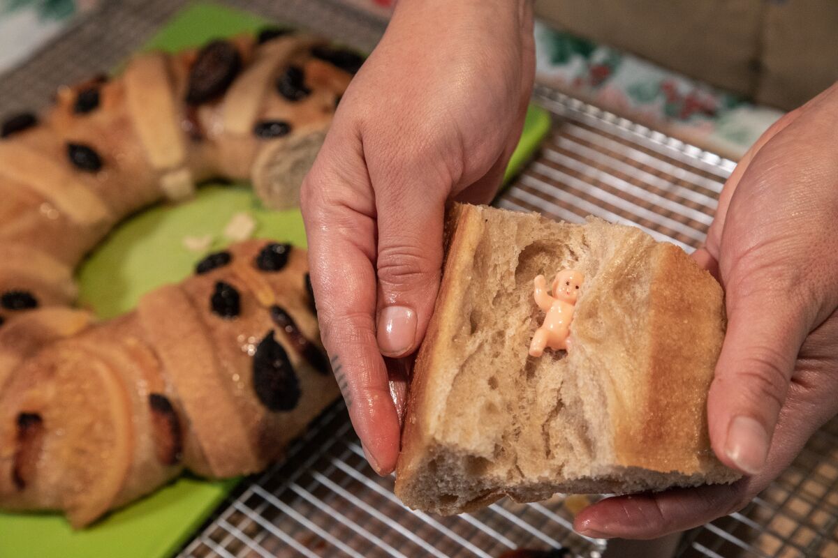  The figurine in the rosca sweet bread represents baby Jesus in hiding. 