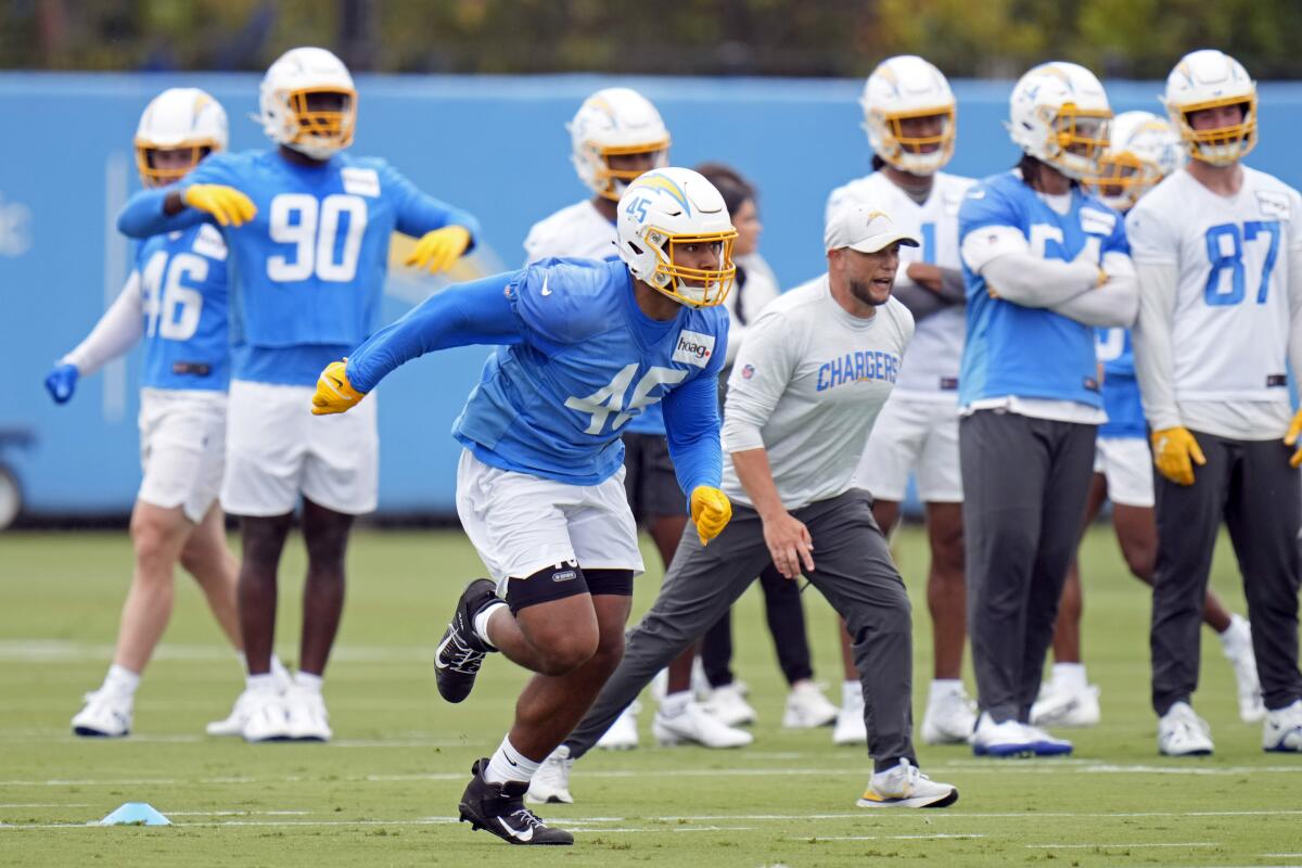 Chargers rookie Tuli Tuipulotu (45) runs a drill during rookie minicamp. He was a great pass rusher for USC.