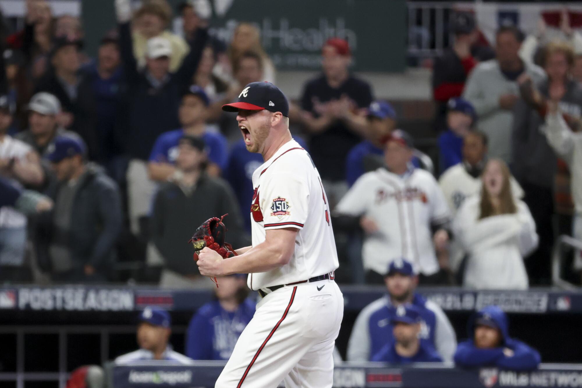 Atlanta Braves relief pitcher Will Smith celebrates after striking out Los Angeles Dodgers' Austin Barnes