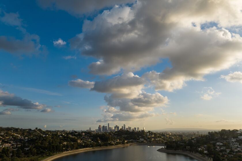 LOS ANGELES, CA - DECEMBER 06: Clouds move through Los Angeles, as seen from the Silver Lake Reservoir, bringing a chance of evening rain. Photographed on Tuesday, Dec. 6, 2022 in Los Angeles, CA. (Myung J. Chun / Los Angeles Times)