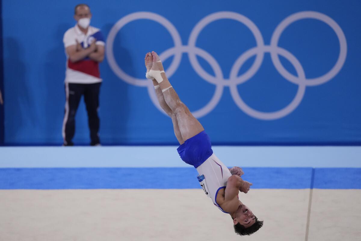 Artur Dalaloyan, of the Russian Olympic Committee, performs a floor routine.