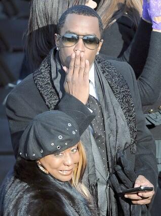 Sean Combs blows a kiss towards photographers prior to the start of the inauguration.