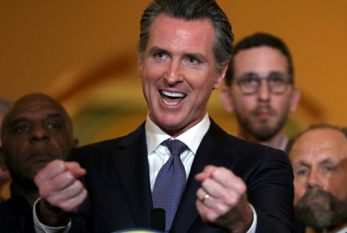 Gov. Gavin Newsom speaks during a news conference at the California State Capitol on Wednesday in Sacramento. Newsom announced a moratorium on California's death penalty.