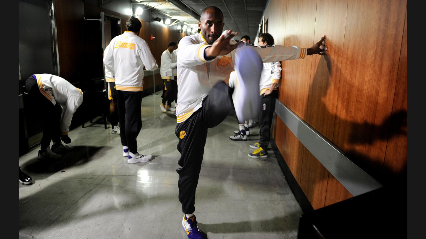 Lakers Kobe Bryant warms up outside the locker room before a game with the Knicks at the Staples Center.