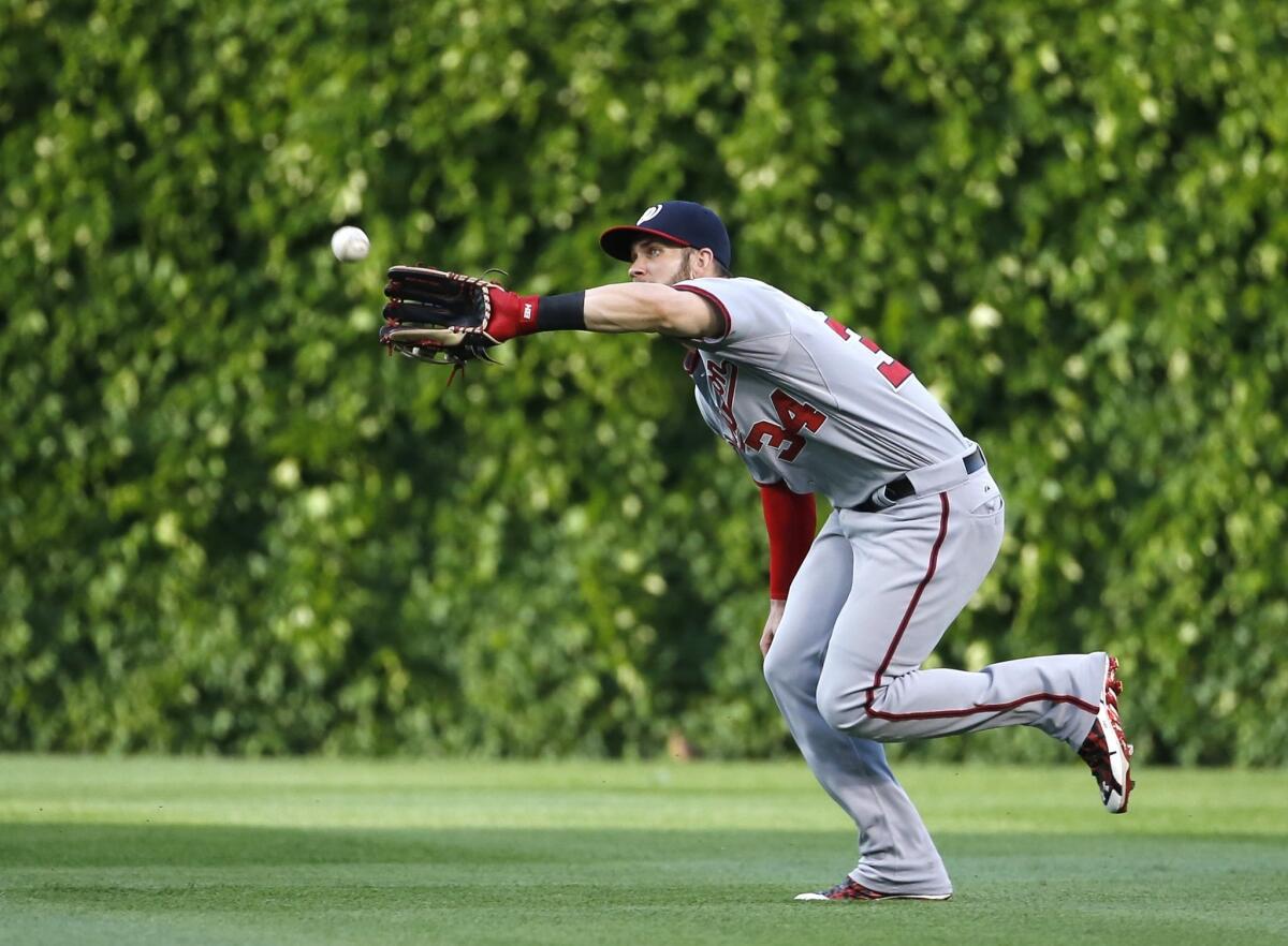 Washington right fielder Bryce Harper catches a fly ball against the Chicago Cubs on May 26.