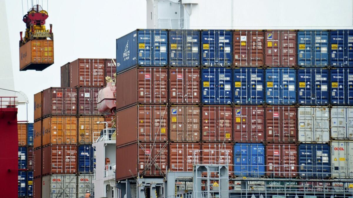 A container is loaded onto a cargo ship at the Tianjin port in China in August 2010.