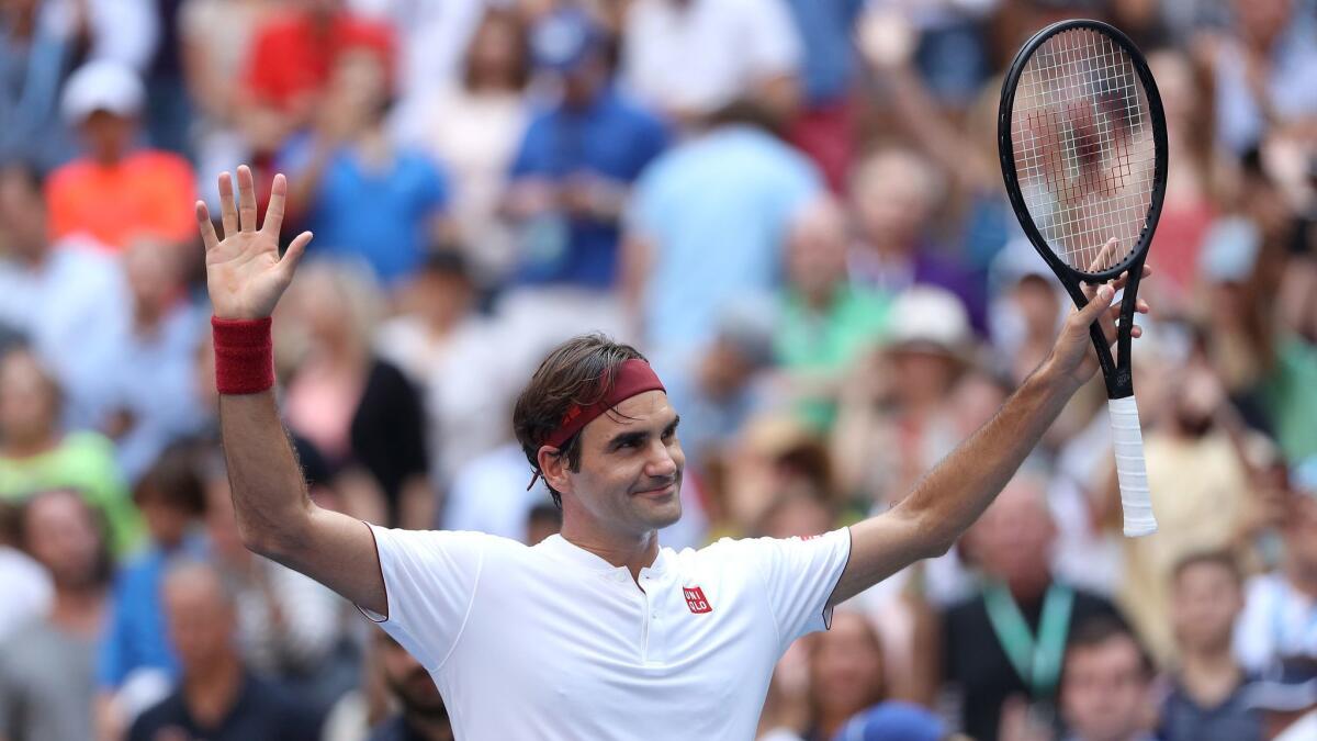 Roger Federer celebrates after winning his third-round match against Nick Kyrgios at the US Open on Saturday.