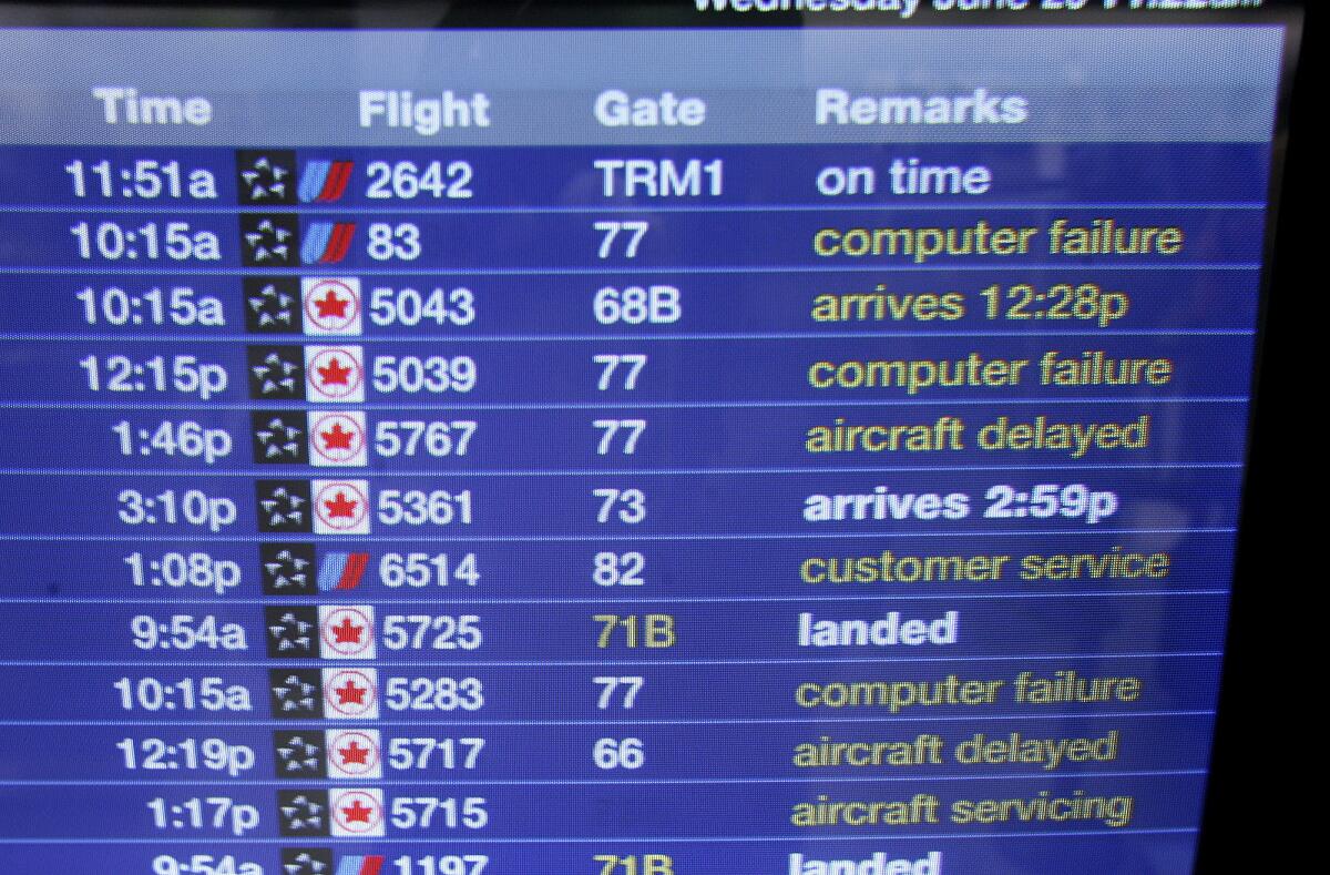 A computer screen at the United Airlines terminal at Los Angeles International Airport shows flight status including notice of computer failure that caused delays across the country June 20, 2007. United Airlines is offering rewards for identifying bugs in the carrier's website or app.