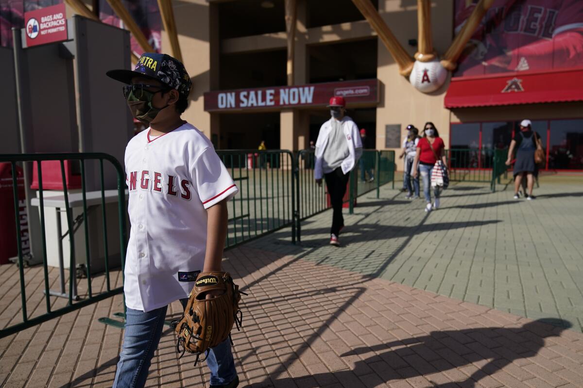 Fans leave Angel Stadium after a scheduled game between the Angels and Minnesota Twins was postponed April 17, 2021.