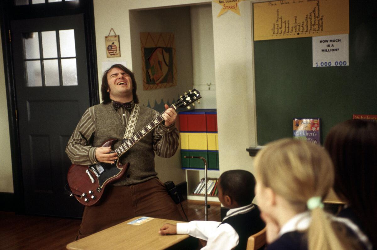 Jack Black playing guitar in a classroom in "School of Rock"