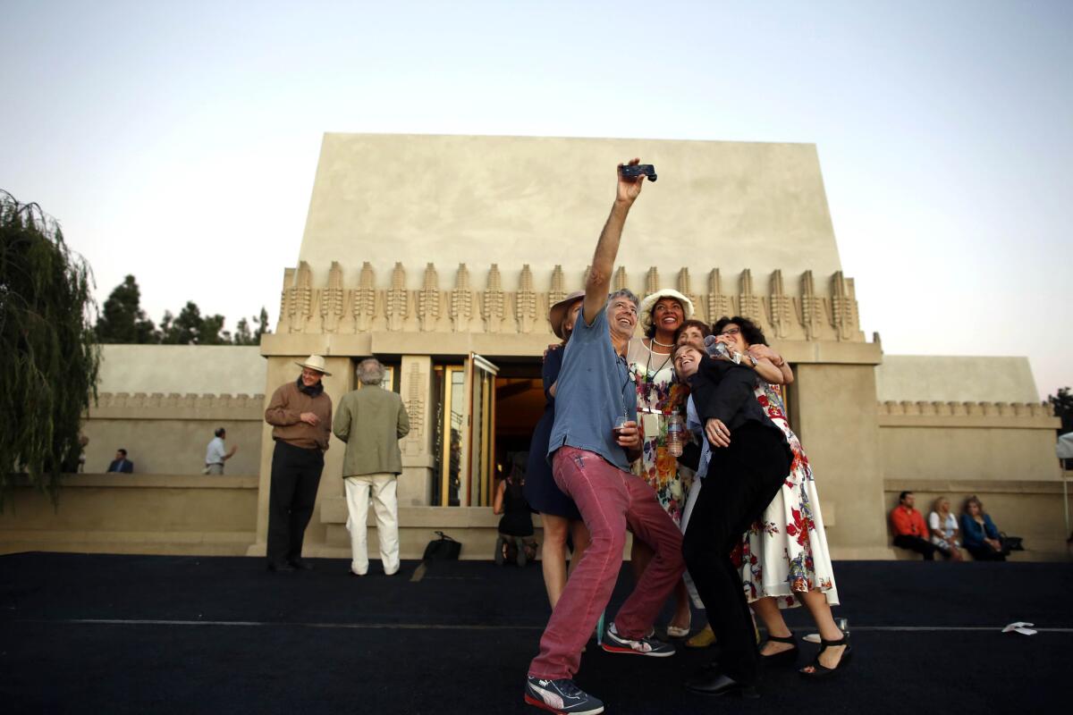 Tod Mesirow and other members of the Barnsdall Art Park Foundation gather during a rare 24-hour opening of the Hollyhock House on Feb. 13.