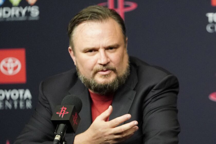 Houston Rockets General Manager Daryl Morey, left, talks about recently acquired guard Russell Westbrook.