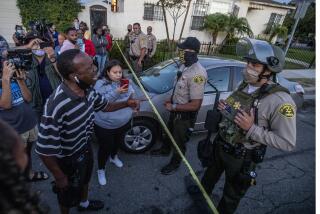 Los Angeles, CA, August 31, 2020. Residents face off with Sheriff's deputies hours after killing Dijon Kizzee in South LA. (Robert Gauthier / Los Angeles Times)