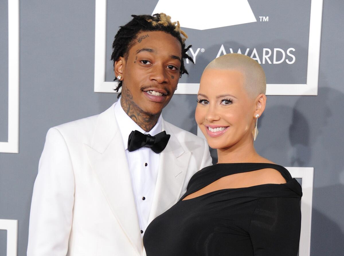Amber Rose denies cheating, accuses rapper Wiz Khalifa of being unfaithful.