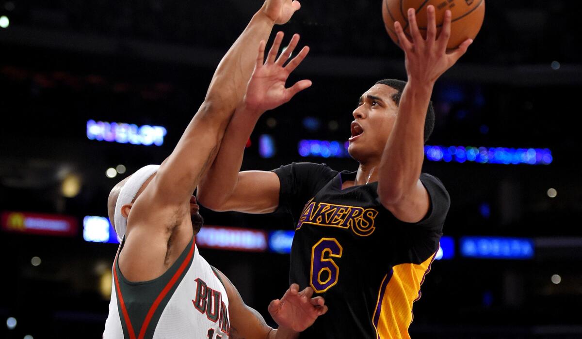 Point guard Jordan Clarkson, who led the Lakers with 16 points, attempts to score on a layup against Bucks guard Jerryd Bayless in the first half Friday night at Staples Center.