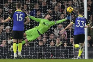 Tottenham goalkeeper Hugo Lloris makes a save during a match against Fulham 