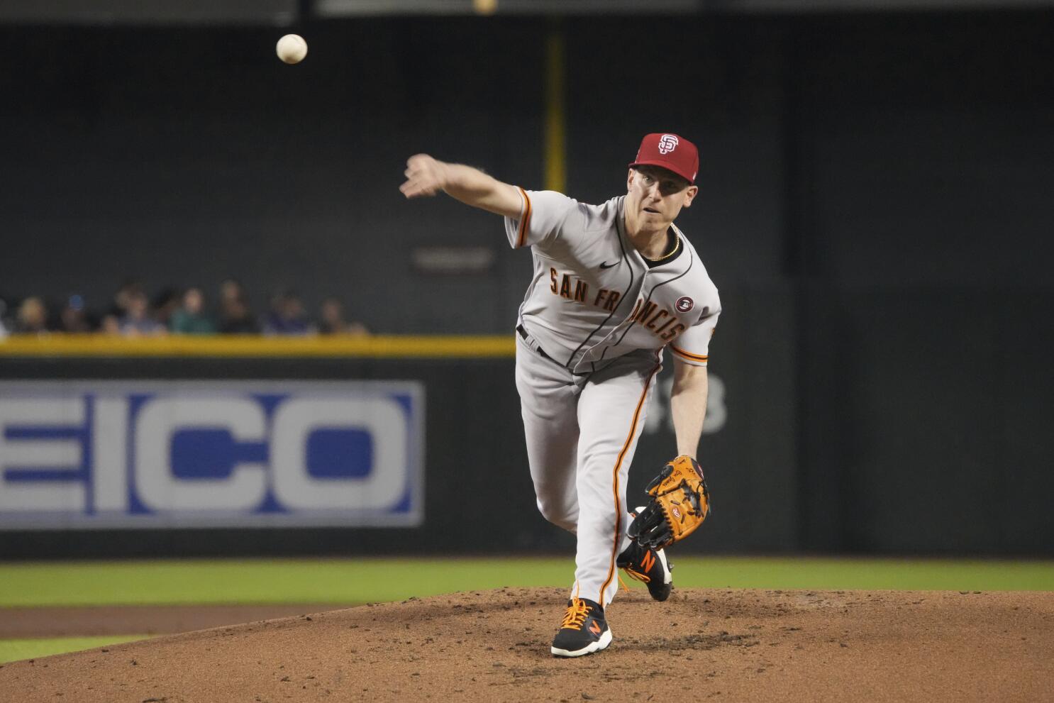 San Francisco Giants' Aaron Sanchez throws to first base during