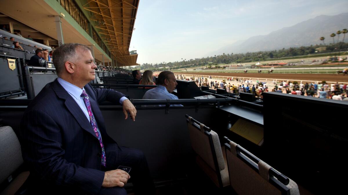 Tim Ritvo, chief operating officer of the Stronach Group racing division, watches a race at Santa Anita Park on June 3.