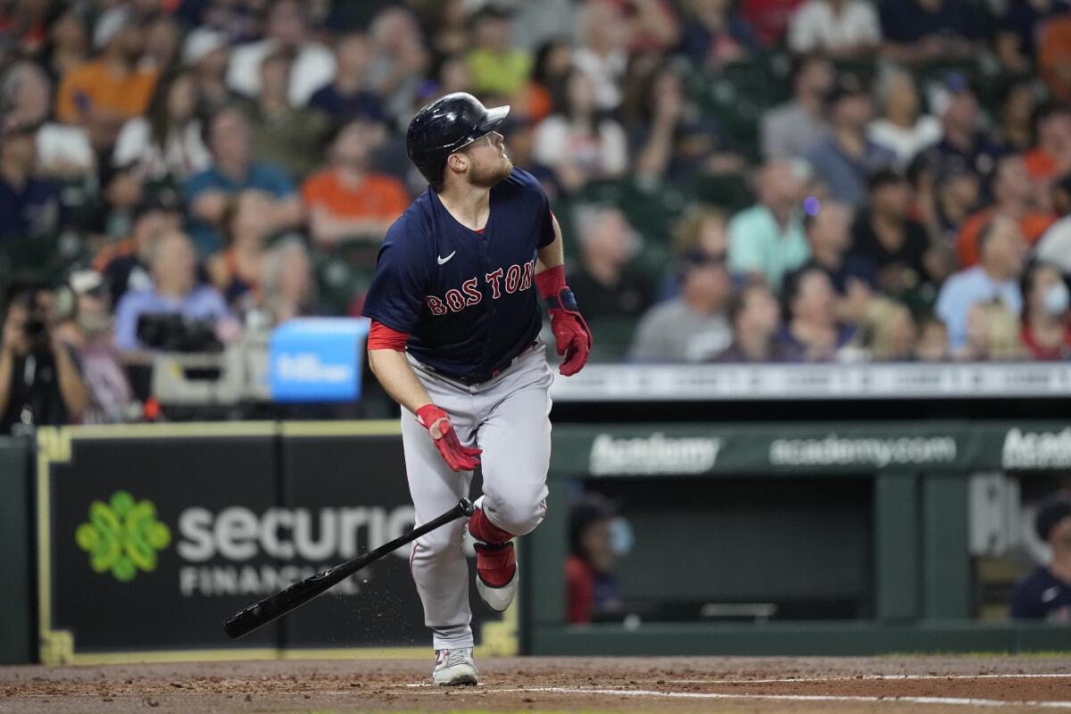 Boston Red Sox's Christian Arroyo watches his three-run home run against the Houston Astros during the second inning of a baseball game Thursday, June 3, 2021, in Houston. (AP Photo/David J. Phillip)