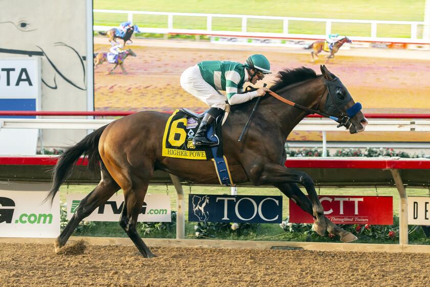 In this image provided by Benoit Photo, Higher Power, with Flavien Prat aboard, wins the Grade I, $1,000,000 Pacific Classic horse race Saturday, Aug. 17, 2019, at Del Mar Thoroughbred Club in Del Mar, Calif. (Benoit Photo via AP)