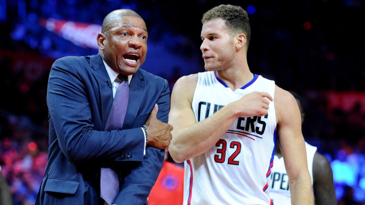 Coach Doc Rivers argues a call in front of Blake Griffin (32) during a game earlier this season.