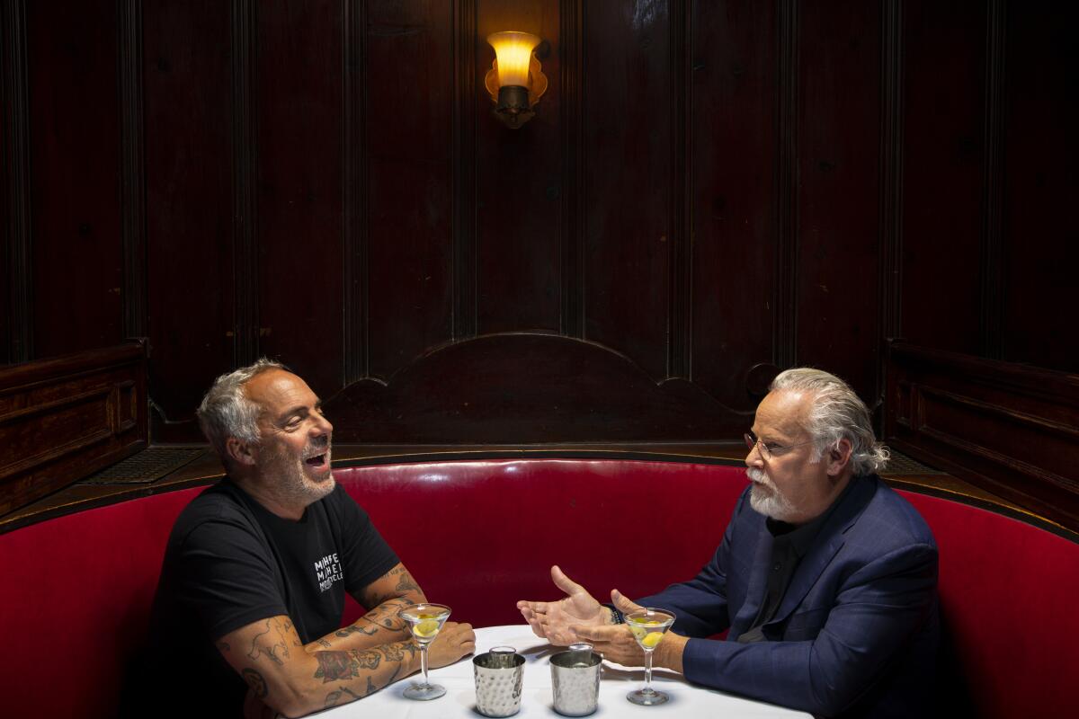 Michael Connelly, right, with actor Titus Welliver, who plays detective Harry Bosch, at Musso & Frank Grill.