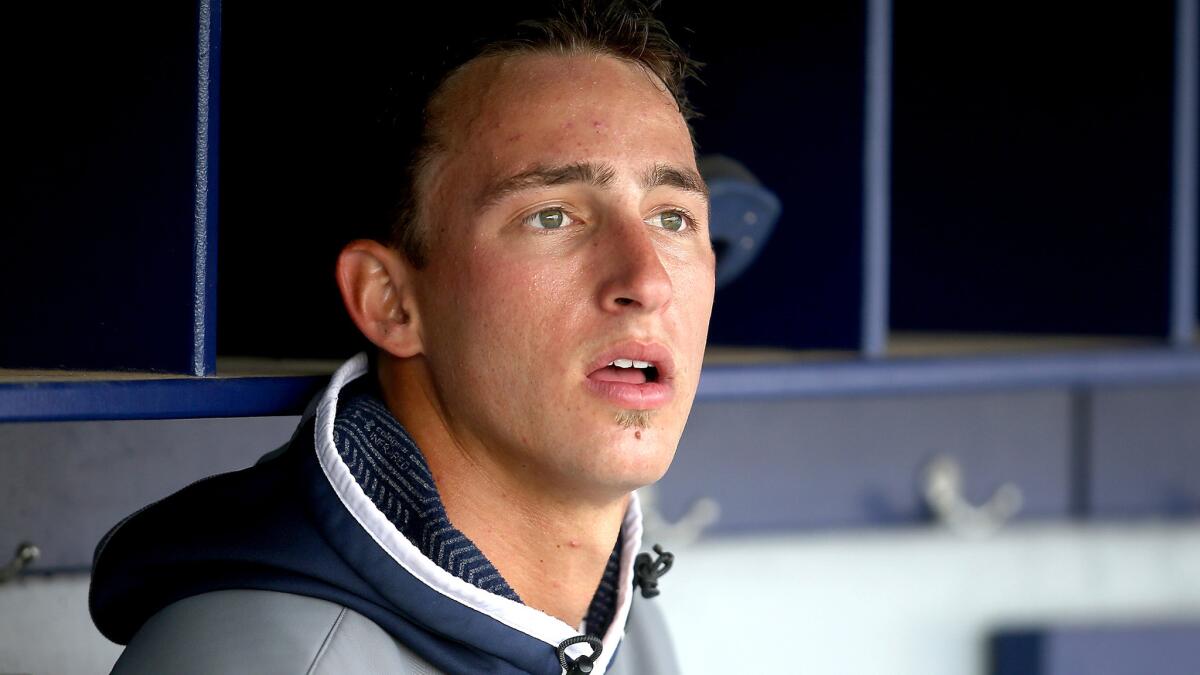 A.J. Puckett watches his Pepperdine teammates bat during the second inning against BYU.