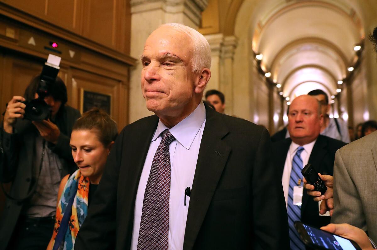 Sen. John McCain (R-AZ) leaves the the Senate chamber at the U.S. Capitol after voting on the GOP 'Skinny Repeal' health care bill on July 28, in Washington.