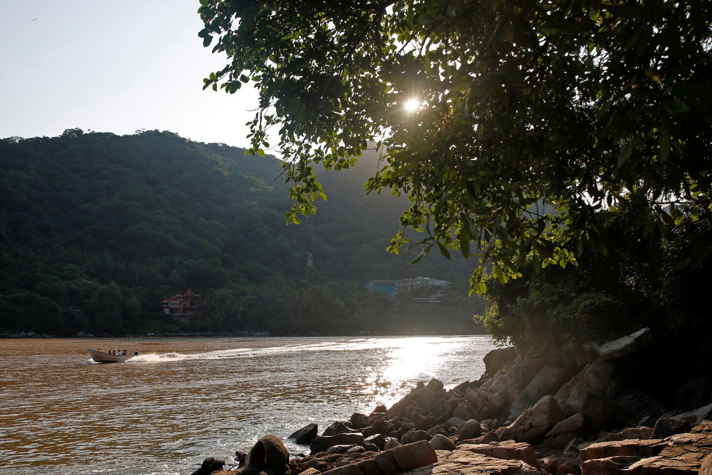 PUERTO VALLARTA, MEX-AUGUST 31, 2019: A boat leaves Boca de Tomatlan in the early morning on August 31, 2019 in Puerto Vallarta, Mexico. The Cabo Corrientes hiking trail is a route that mostly hugs the coastline. (Photo By Dania Maxwell / Los Angeles Times)