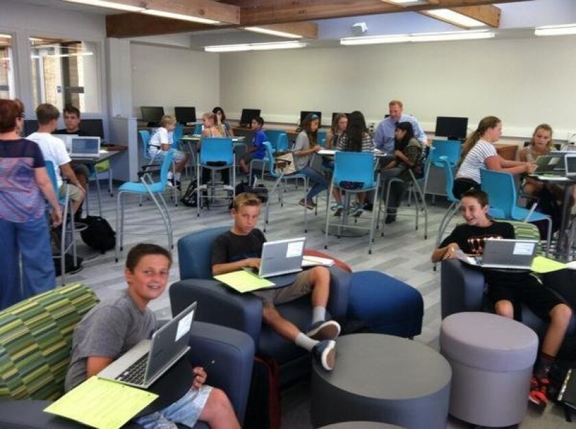 Students get comfortable in the new media center at Diegueno Middle School.