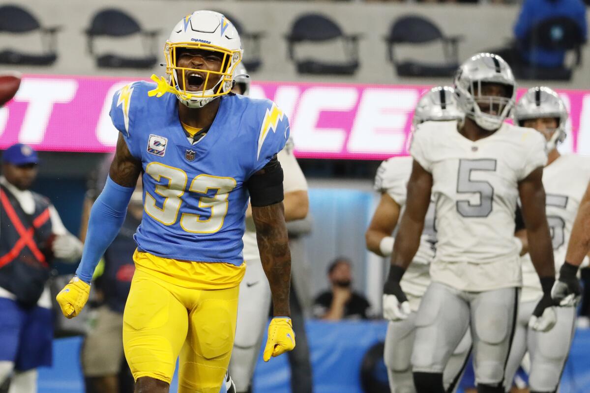 Chargers safety Derwin James celebrates after stopping the Raiders on third down in the first half at SoFi Stadium.
