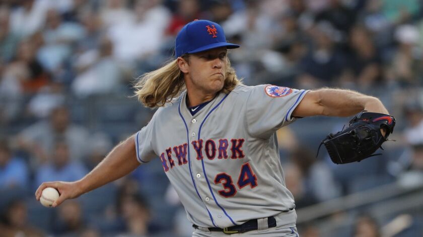 New York Mets starting pitcher Noah Syndergaard (34) delivers against the New York Yankees during the first inning of a baseball game, Friday, July 20.