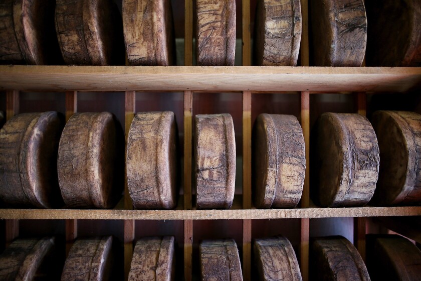 Artisanal cheesemakers say wooden shelves give the cheese flavor and help regulate moisture as it ages. Scientists and the FDA, however, say the wood could harbor dangerous bacteria.