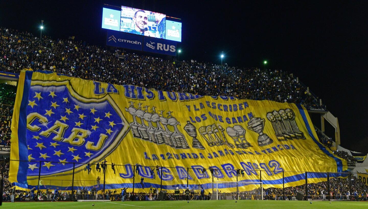 Boca Juniors's newly returned player Carlos Tevez is warmly welcomed by supporters during his official presentation at La Bombonera stadium in Buenos Aires,on July 13, 2015. AFP PHOTO / ALEJANDRO PAGNIALEJANDRO PAGNI/AFP/Getty Images ** OUTS - ELSENT, FPG - OUTS * NM, PH, VA if sourced by CT, LA or MoD **