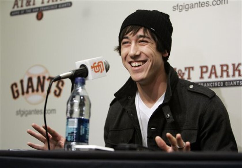 San Francisco Giants pitcher Tim Lincecum, this year's National League Cy Young Award winner, laughs while talking about his many nicknames during a news conference at AT&T Park in San Francisco, Tuesday, Nov. 11, 2008. Lincecum took home pitching's highest honor in his second major league season. The slender kid with the whirling windup on Tuesday joined Mike McCormick as the only San Francisco Giants pitchers to win a Cy Young.(AP Photo/Eric Risberg)