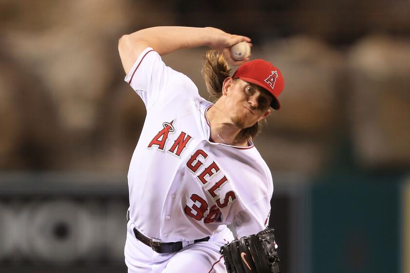 Jered Weaver allowed two runs and struck out seven in seven innings against Texas on Saturday night.