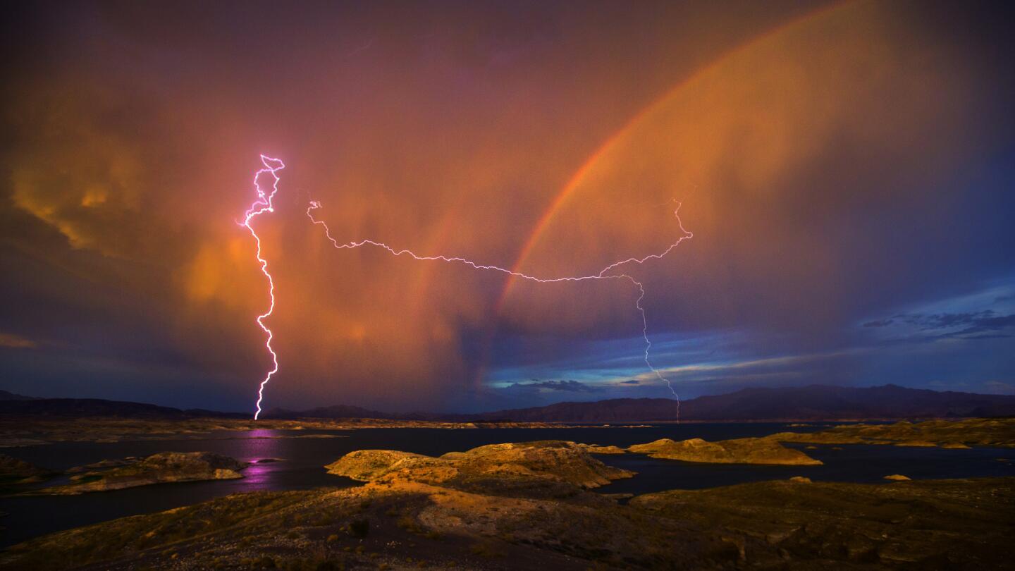 Lightning and a rainbow form over Lake Mead National Recreation Area in Nevada. Lake Mead is at a historic low due to the ongoing drought.