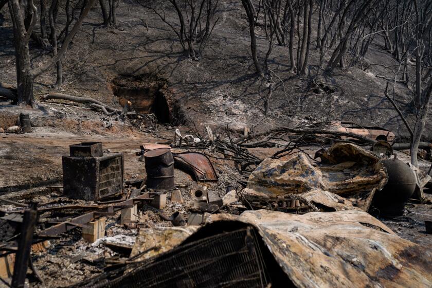 NAPA, CA - AUGUST 25: Burnt out wreckage at a property along CA-128 where the LNU Lightning complex fire tore through last week, photographed on Tuesday, Aug. 25, 2020 in Napa, CA. McNeal said his mother, Mary Hintemeyer, her boyfriend Leo McDermott and his son, Tom McDermott took refuge from the LNU Lightning Complex Fire in a makeshift fire shelter on their Napa County property, but the trio never made it out alive.