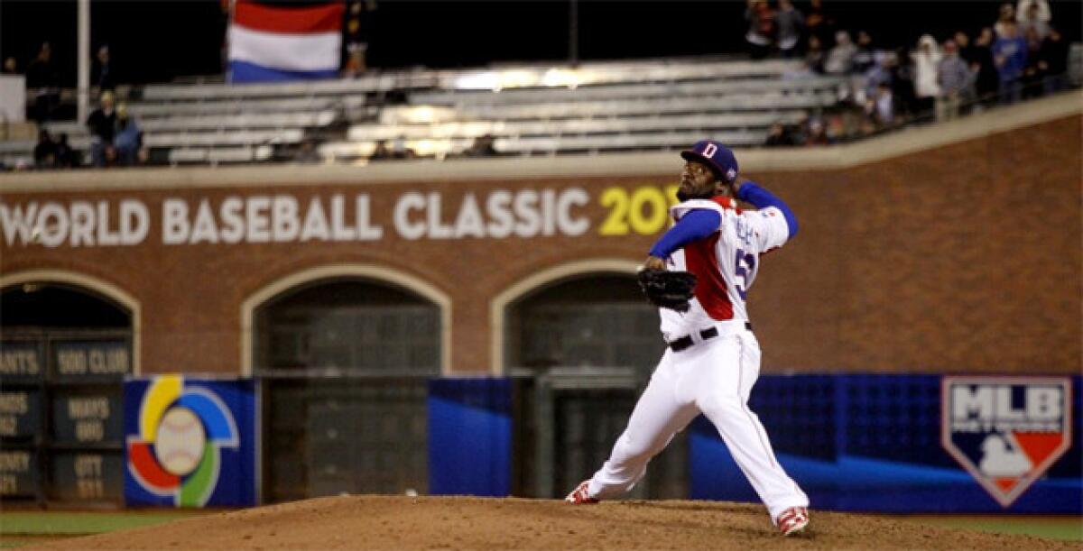 Dominican Republic relief pitcher Fernando Rodney delivers against the Netherlands in the ninth inning.