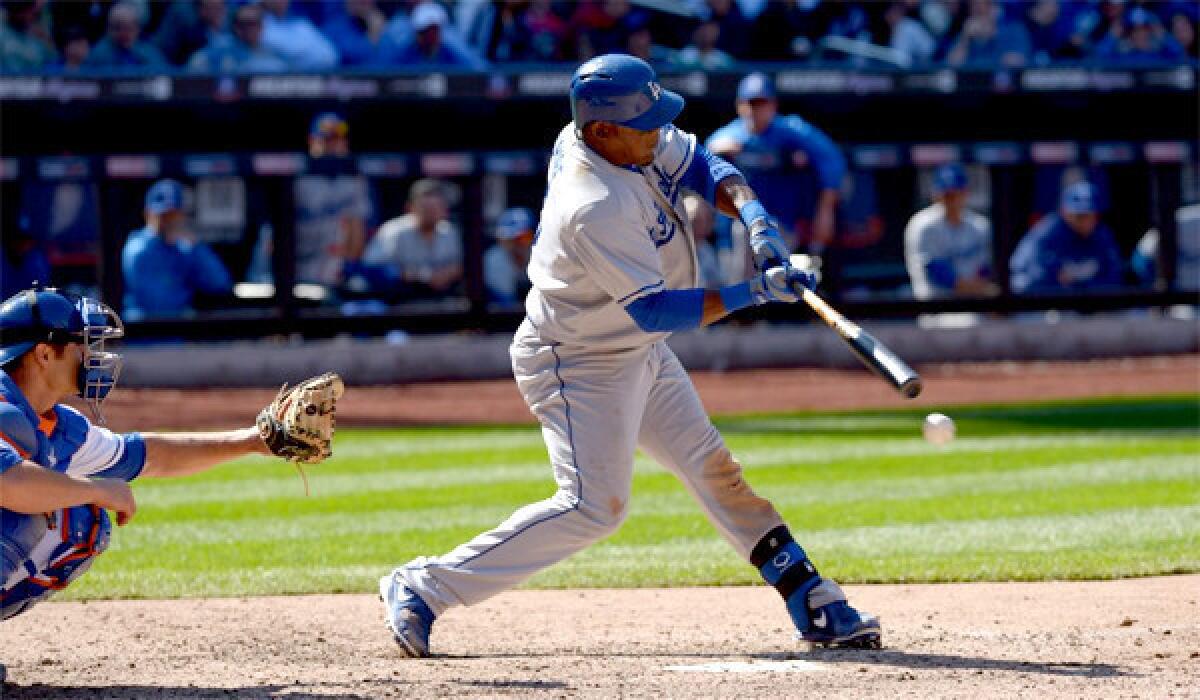 Juan Uribe hits an RBI single in the ninth inning of the Dodgers' 3-2 win over the New York Mets on Thursday.