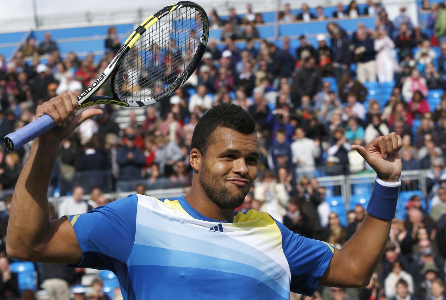 France's Jo-Wilfried Tsonga celebrates winning his men's singles tennis match against Igor Sijsling from Netherlands at the Queen's Club Championships in west London