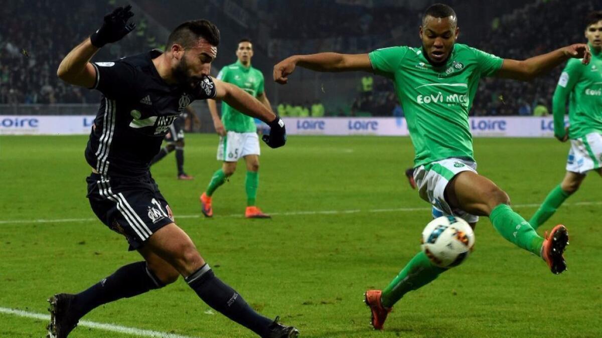 Olympique de Marseille forward Romain Alessandrini, left, vies with Saint-Etienne's defender Pierre-Yves Polomat during a game Nov. 30.