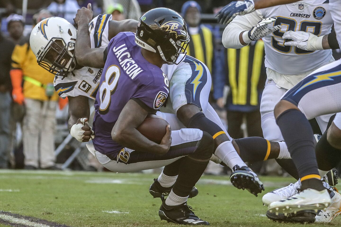 Chargers linebacker Melvin Ingram sacks Ravens quarterback Lamar Jackson during third quarter.