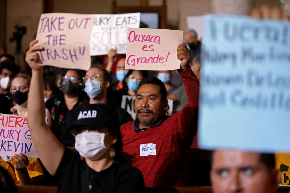 Protestors at the Los Angeles City Council meeting in the Council Chamber at Los Angeles City Hall.