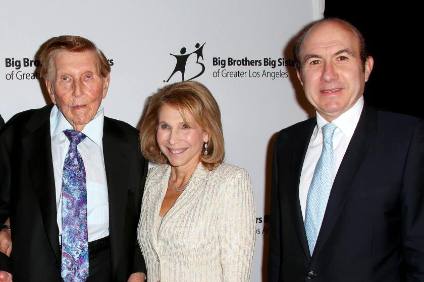 Sumner Redstone's former companion, Manuela Herzer, filed a motion Monday, seeking a new trial. Pictured in 2012: Sumner Redstone, his daughter, Shari Redstone who is vice chair of Viacom, and Viacom Chief Executive Philippe Dauman.