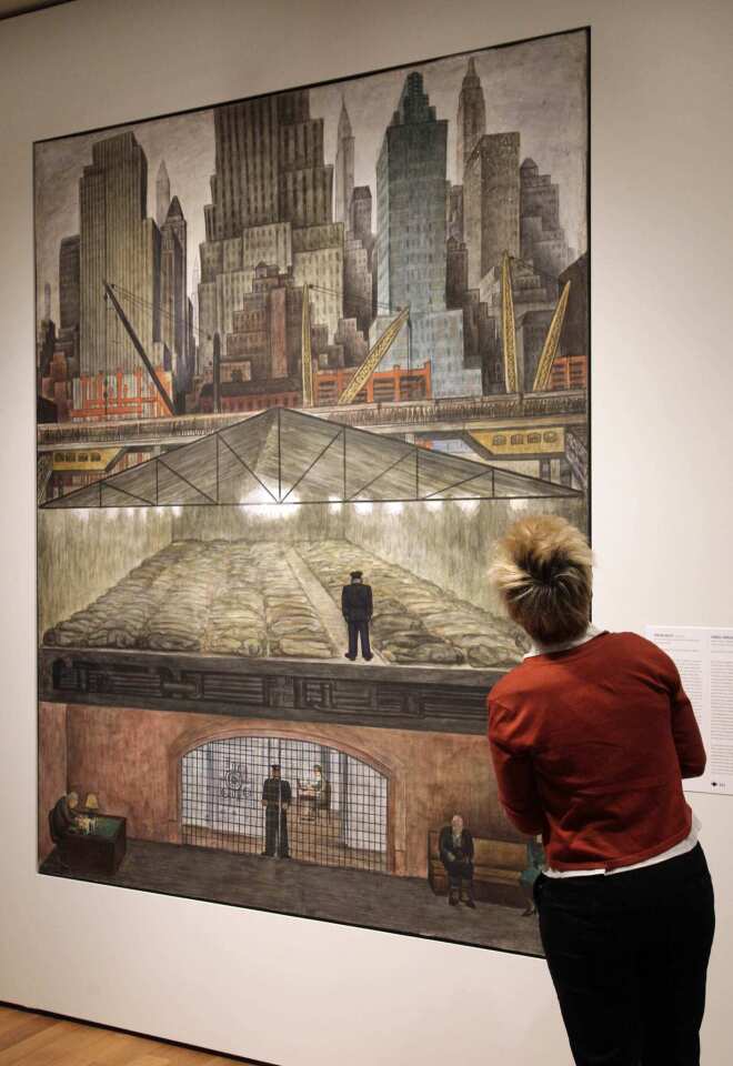 A woman looks at Mexican painter Diego Rivera's "Frozen Assets," displayed during a preview at New York's Museum of Modern Art.