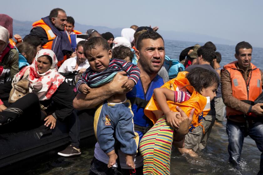 Syrian refugees arrive aboard a dinghy after crossing from Turkey to the island of Lesbos, Greece on Sept. 10. The US is making plans to accept 10,000 Syrian refugees in the coming budget year, a significant increase from the 1,500 migrants that have been cleared to resettle in the U.S. since civil war broke out in the Middle Eastern country more than four years ago.
