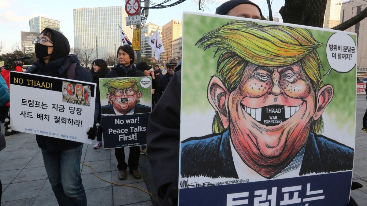 In February, demonstrators gather in Seoul to oppose plans to deploy the Terminal High-Altitude Area Defense system, or THAAD, in South Korea.