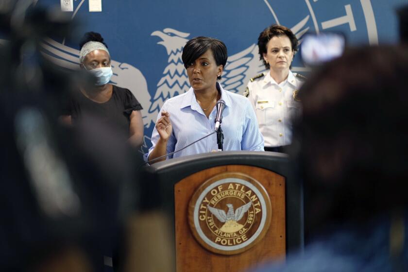 Atlanta Mayor Keisha Lance Bottoms announces a 9 PM curfew as protests continue for a second day over the death of George Floyd, Saturday, May 30, 2020 in Atlanta. Protests were held throughout the country over the death of Floyd, a black man who died after being restrained by Minneapolis police officers on May 25. (Ben Gray/Atlanta Journal-Constitution via AP)