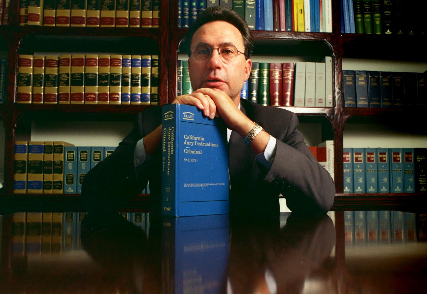 Jack Earley, one of the top criminal defense attorneys in Orange County, is shown in his Irvine law library. Among his high-profile clients is Betty Broderick.